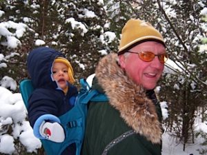 Grandpa Shelby, snow shoeing with one of his grandchildren.