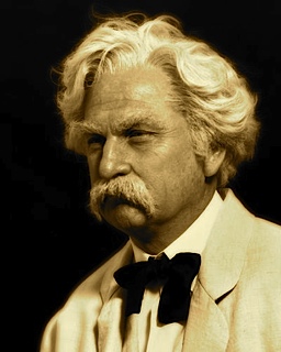 Don Shelby in costume and makeup, as he portrays Mark Twain on stage.