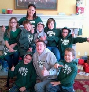 Amy with a joyous group of young MSU Spartan fans, ready for a Rose Bowl victory.