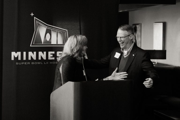 Maureen celebrated with Richard Davis of US Bank, when Minnesota won the 2018 bid to host the Super Bowl.